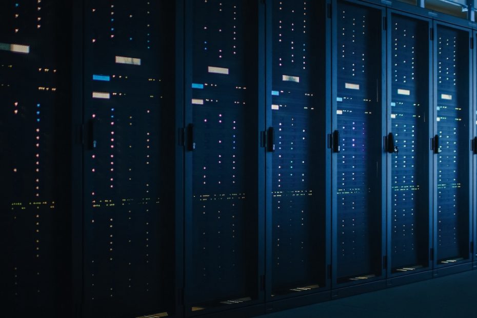 Shot of Dark Data Center With Multiple Rows of Fully Operational Server Racks. Modern Telecommunications, Cloud Computing, Artificial Intelligence, Database, Supercomputer.